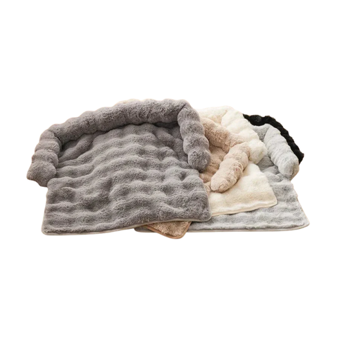 Plush rectangular dog beds in multiple colors, featuring soft wavy quilting and raised cushioned edges for comfort.