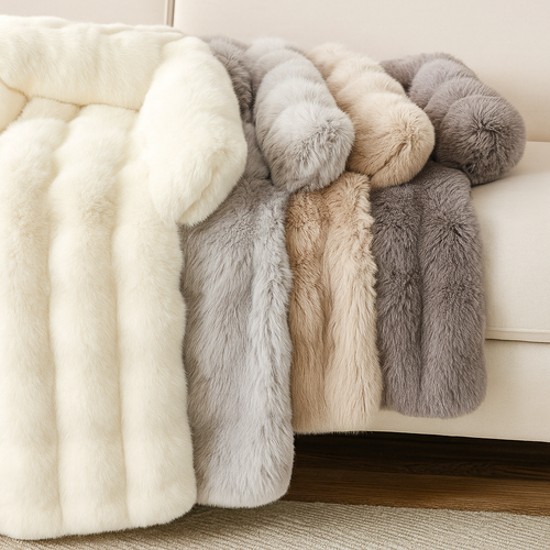 Collection of fluffy pet beds in various colors draped over a sofa. 