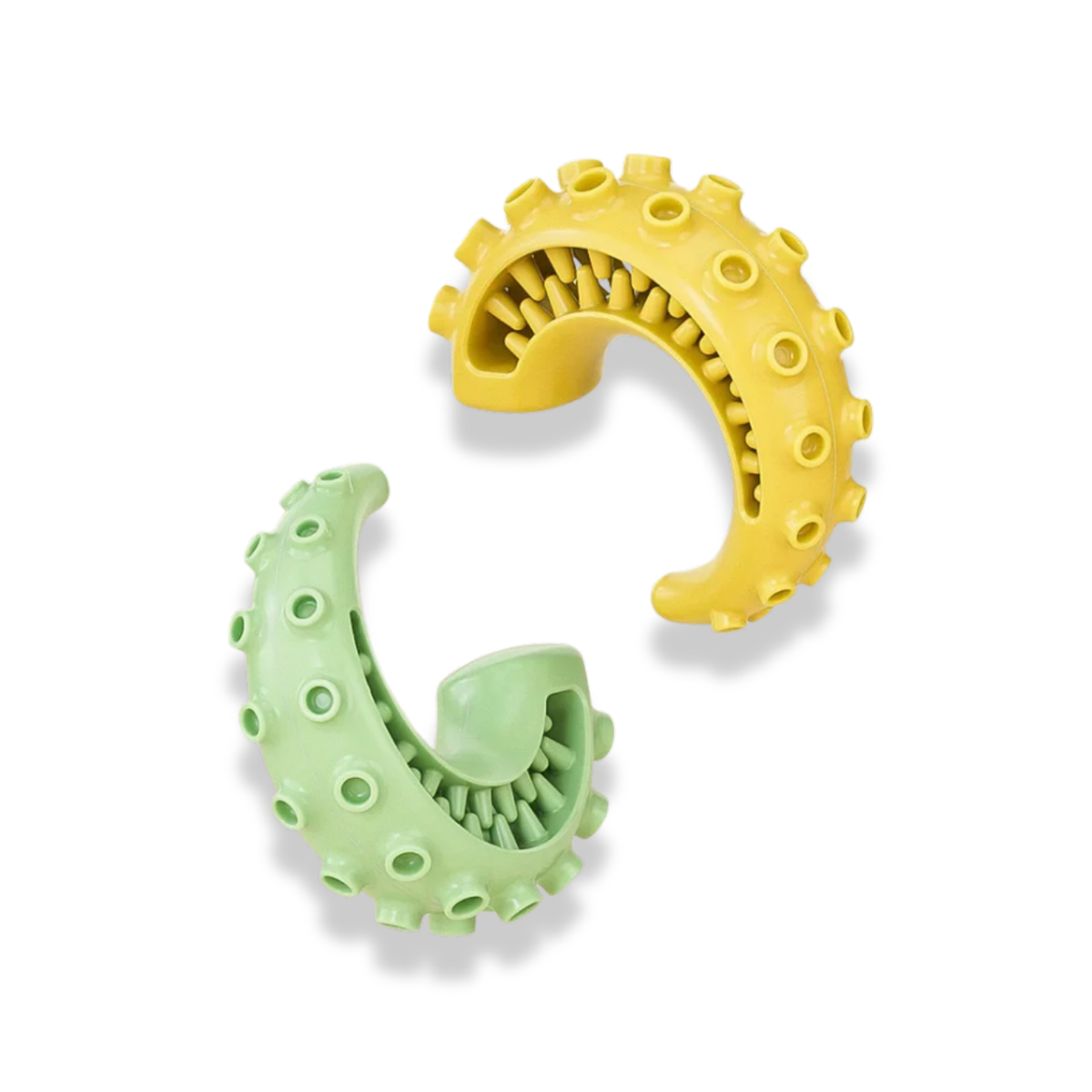 Two banana shape dental toy for dogs in green and yellow on a white background