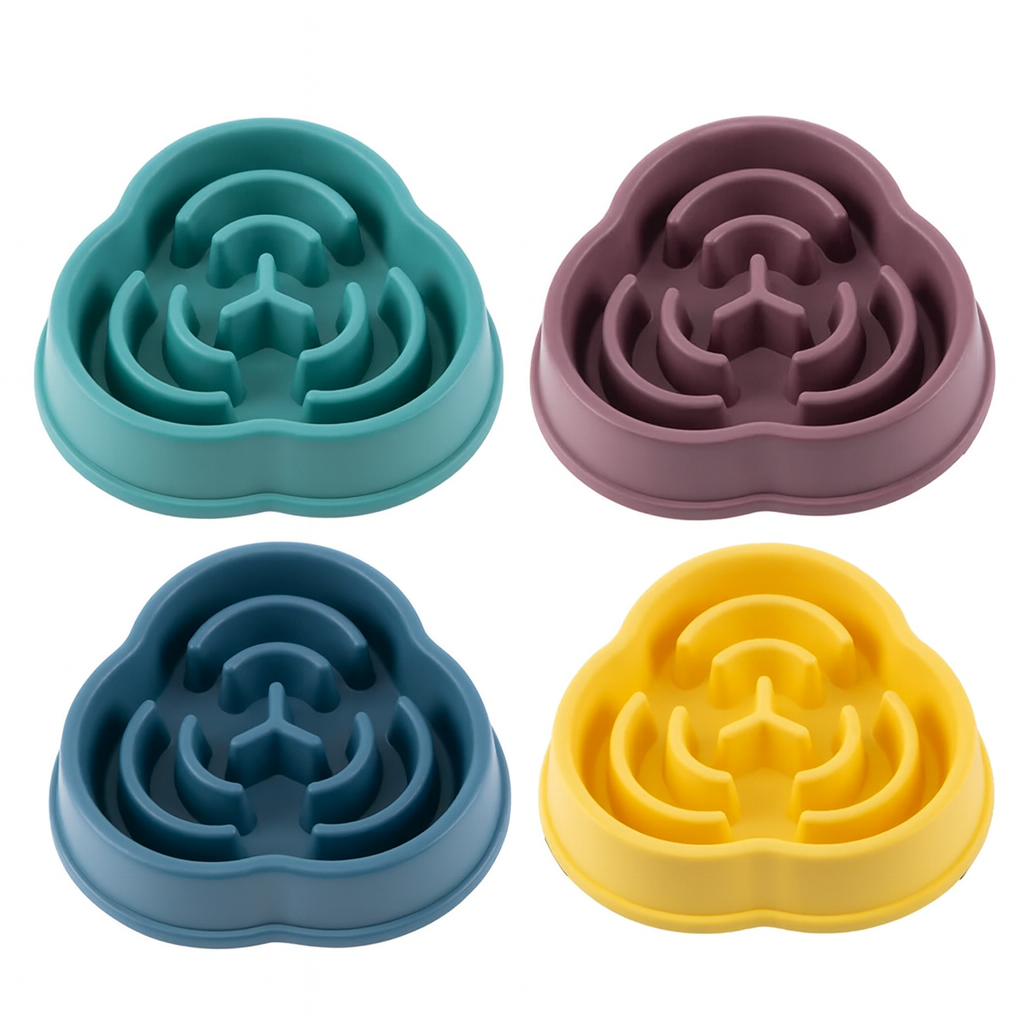 Four petal-shaped silicone pet slow feeder in teal, purple, blue, and yellow on a white background.
