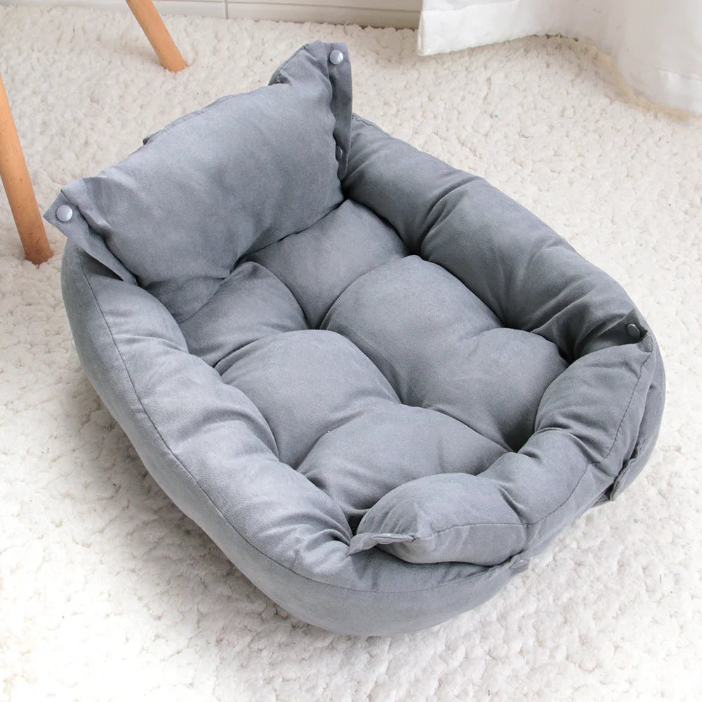 A gray cushioned convertible pet bed arranged in sofa style.