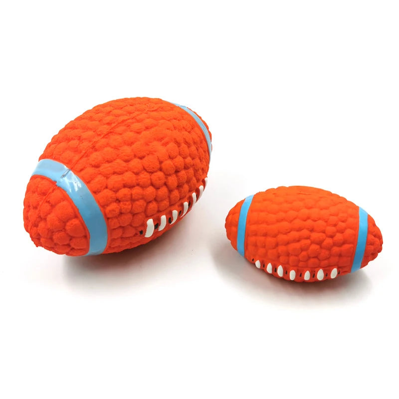 Two orange textured football-shaped dog toys with blue bands on a white background