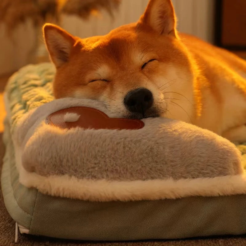 Shiba Inu sleeping on green memory foam dog bed with soft, elevated build-in pillow.