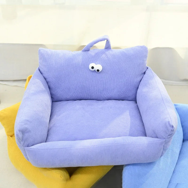Light purple velvet pet bed with cartoon eyes and raised side cushions for cats and dogs.