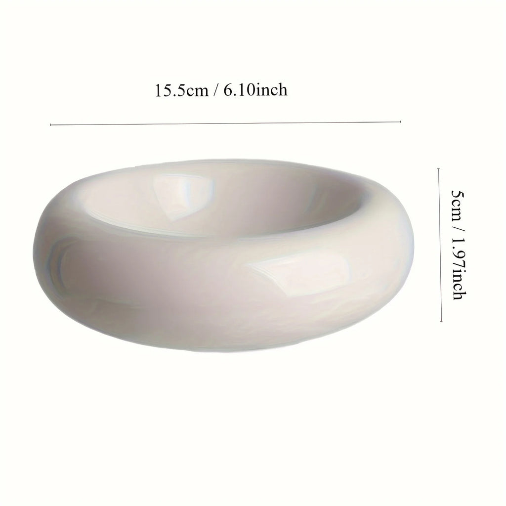 White ceramic pet dish with measurements on a white background