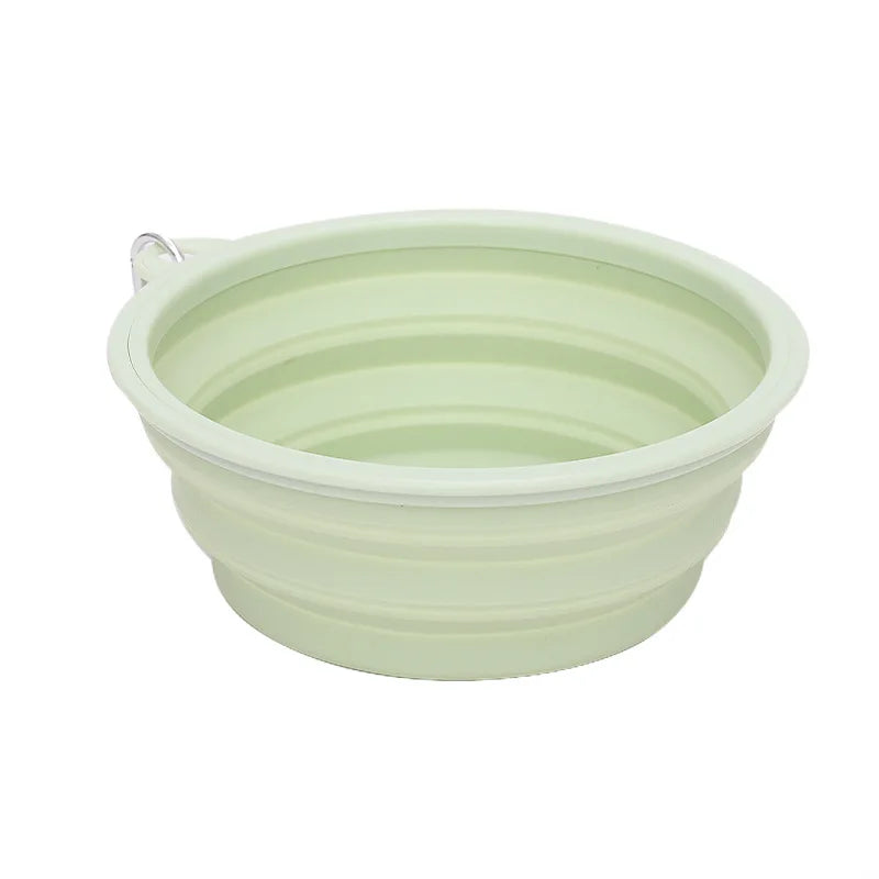 Foldable light green pet bowl on a white background