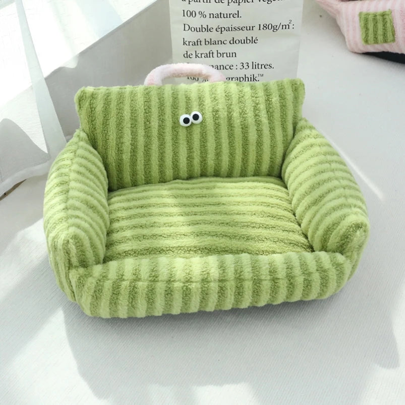 Green striped velvet pet bed with soft plush sides and portable handle.