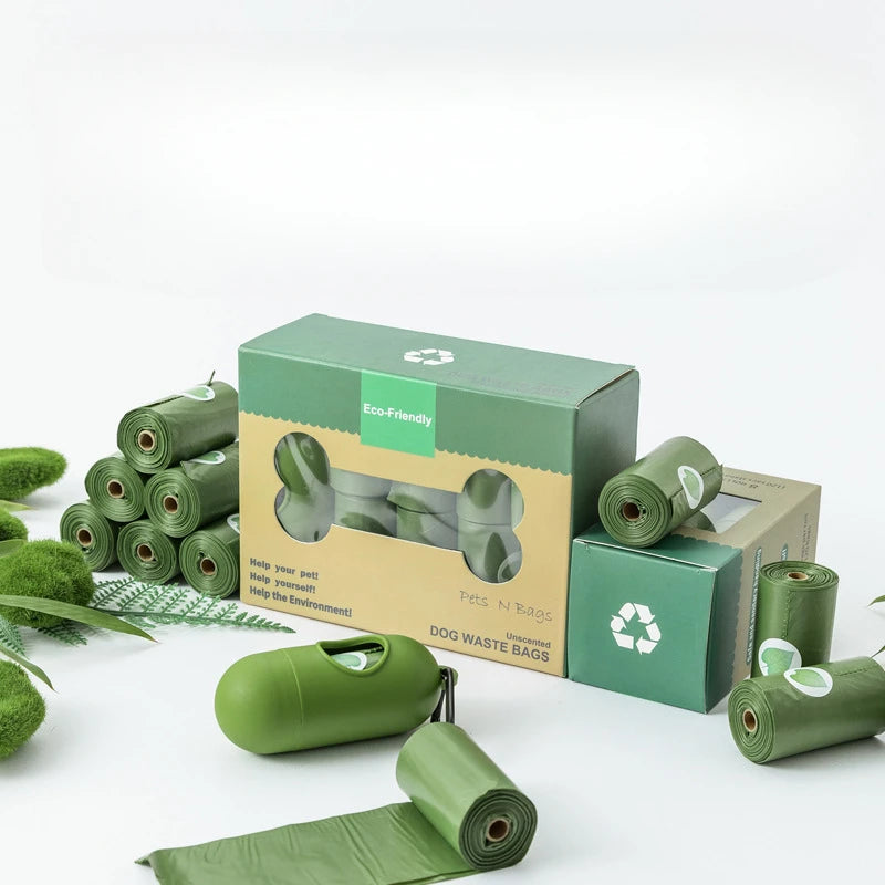 Green Eco-friendly dog waste bags with dispenser and packaging, biodegradable design.Eco-friendly dog waste bags with dispenser and packaging, biodegradable design.