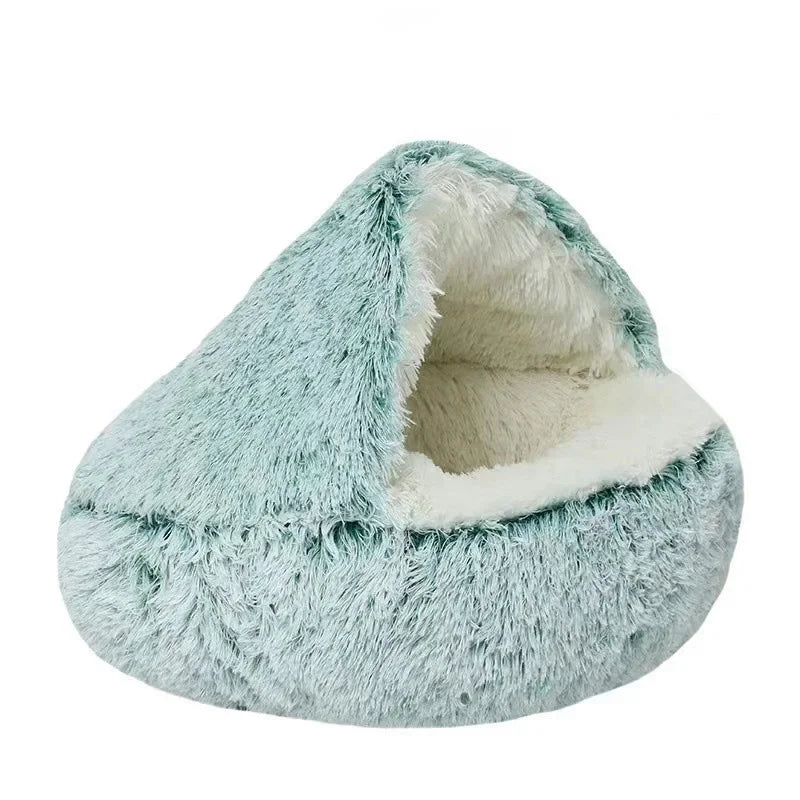 Teal and white fluffy pet bed on a white background