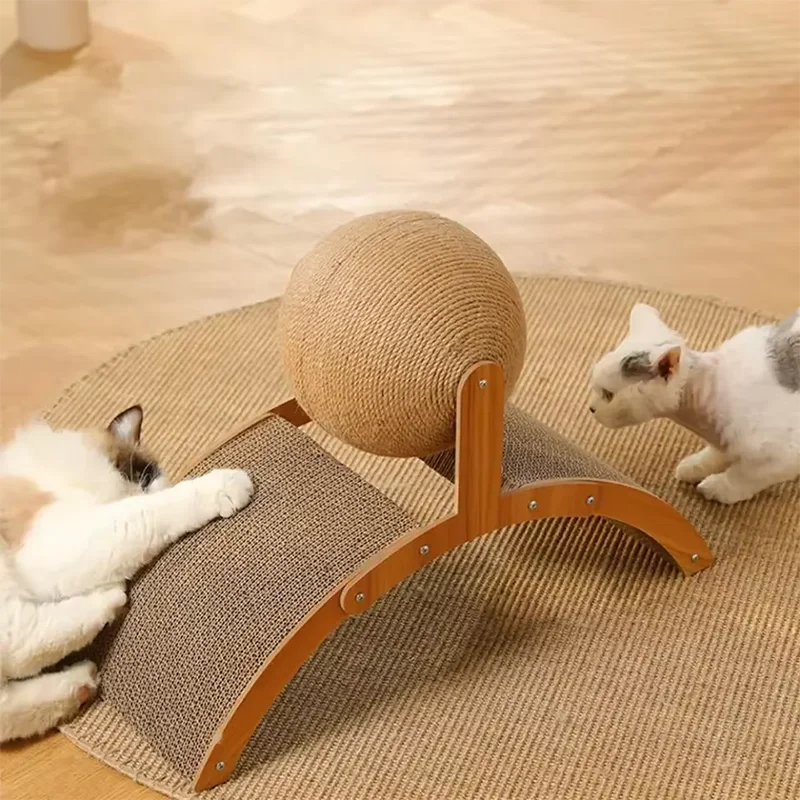 Cats playing with sisal ball on a cat scratcher in a home setting