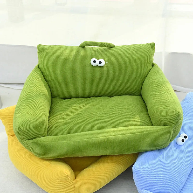 Solid green velvet pet bed with cartoon eyes and soft cotton filling.