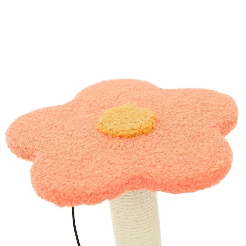 A peach-colored flower-shaped platform with a yellow center attached to the top of a scratching post.