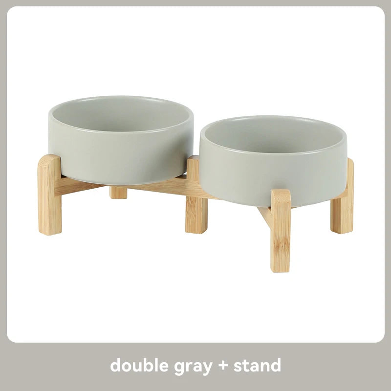 Double gray ceramic pet bowl with wooden stand on a white background