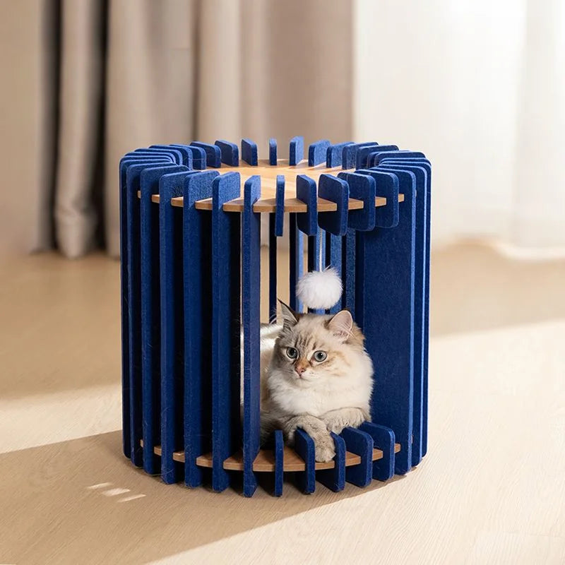 Blue modular cat house with a white cat sitting inside, round design with toy ball.