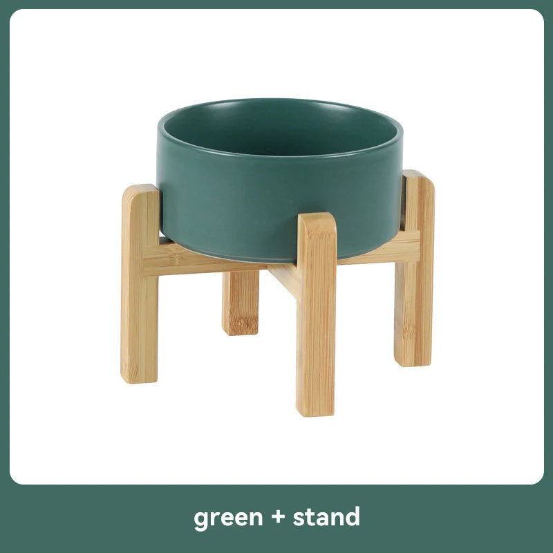 Green ceramic bowl on a wooden stand 