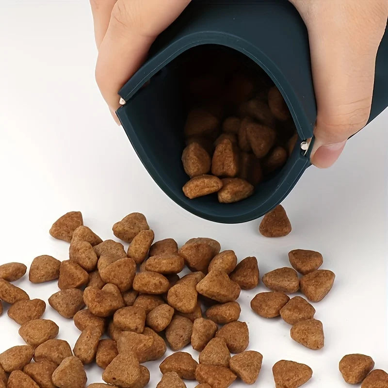 Hand pouring pet treats from silicone training pouch – TreatMate Pawch.