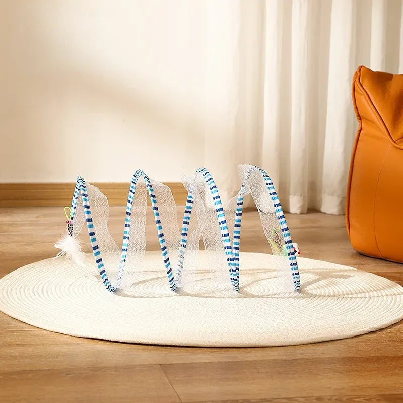 A spiral cat tunnel with striped blue-and-white trim, standing open on a rug.
