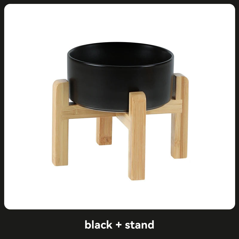 Black ceramic pet bowl on a wooden stand 