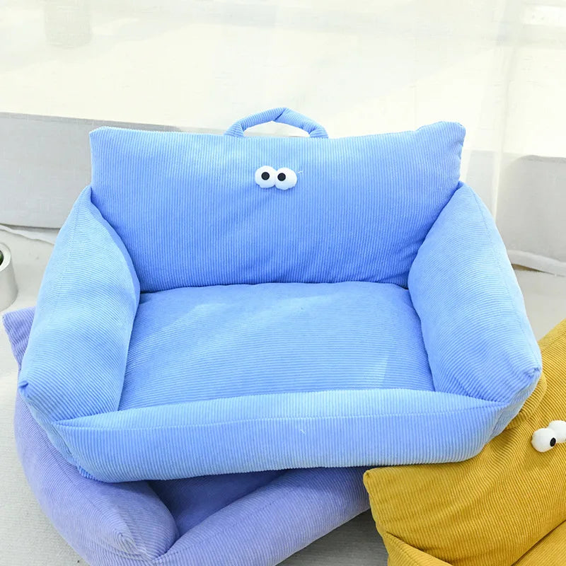 Solid blue velvet pet bed with plush filling and raised supportive sides.