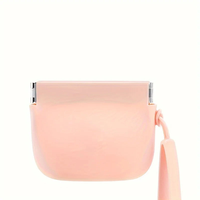 Pink silicone pet treat pouch with detachable wrist strap.