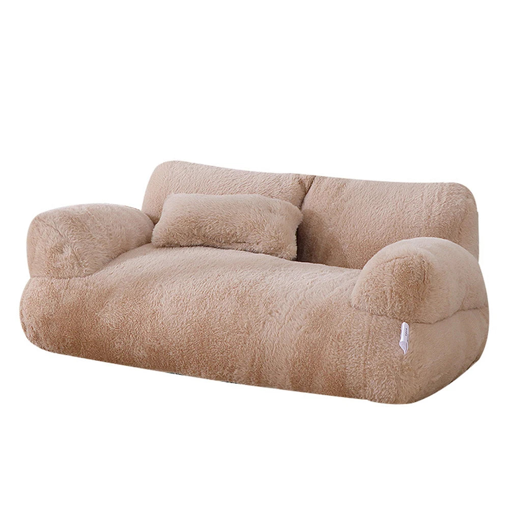Beige plush sofa pet bed with matching pillow for cats and dogs.
