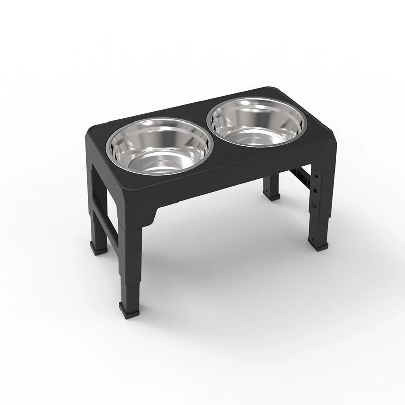 Black elevated pet feeder with two silver stainless steel bowls on a white background