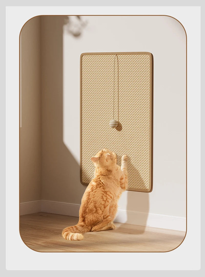 Orange cat playing with wall-mounted scratching board featuring a hanging toy ball.