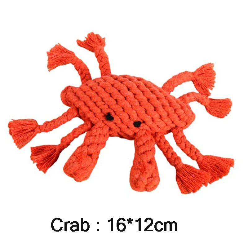 Red crab-shaped rope toy on a white background