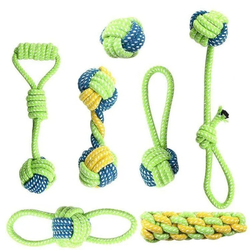 et of colorful green, blue, and yellow rope dog toys in different shapes with knots and loops.