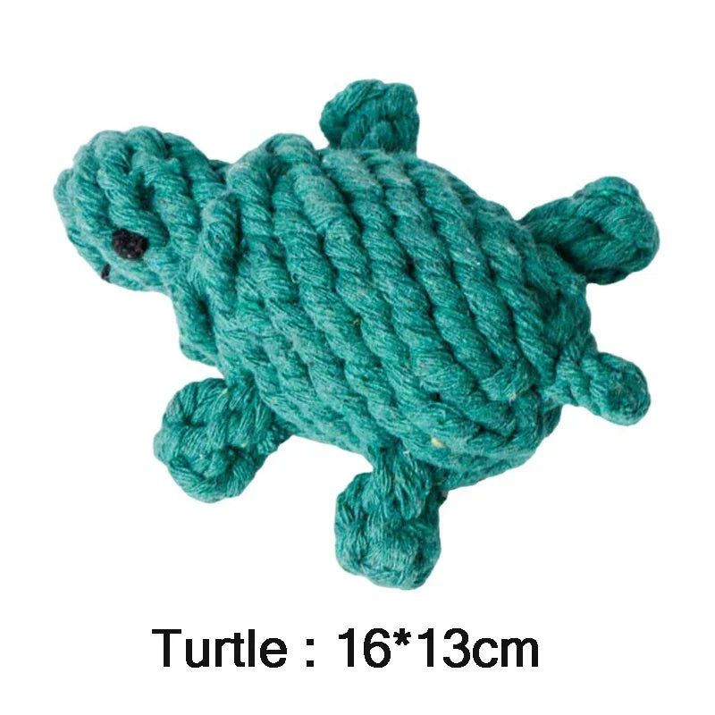 Teal turtle-shaped rope toy on a white background