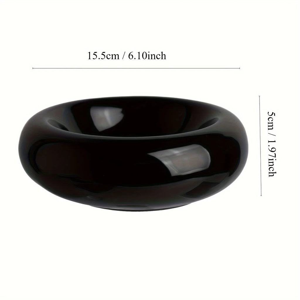 Black ceramic bowl with measurements on a white background