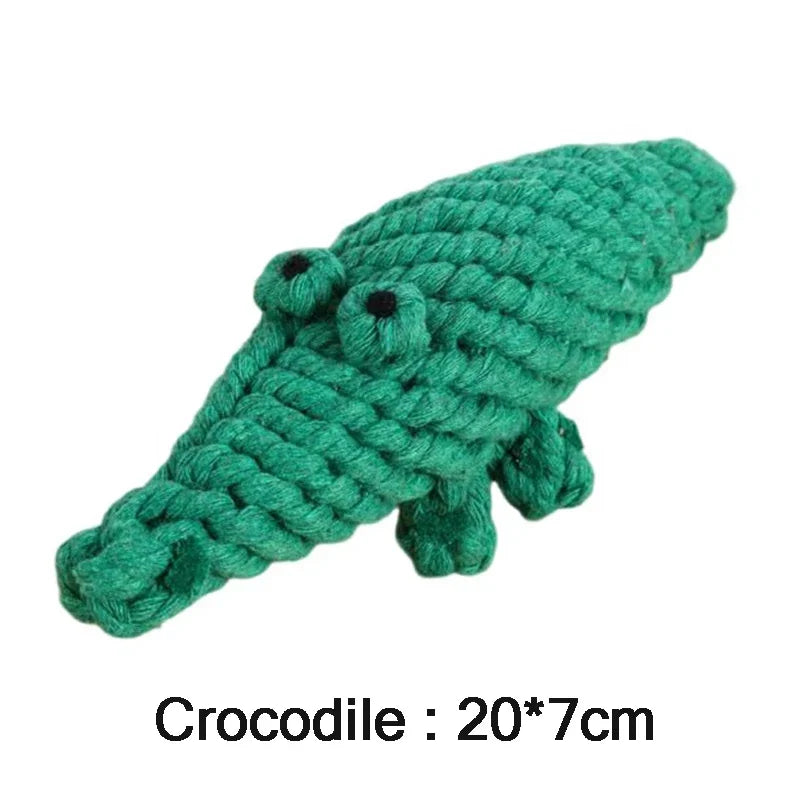 Green crocodile-shaped rope toy on a white background