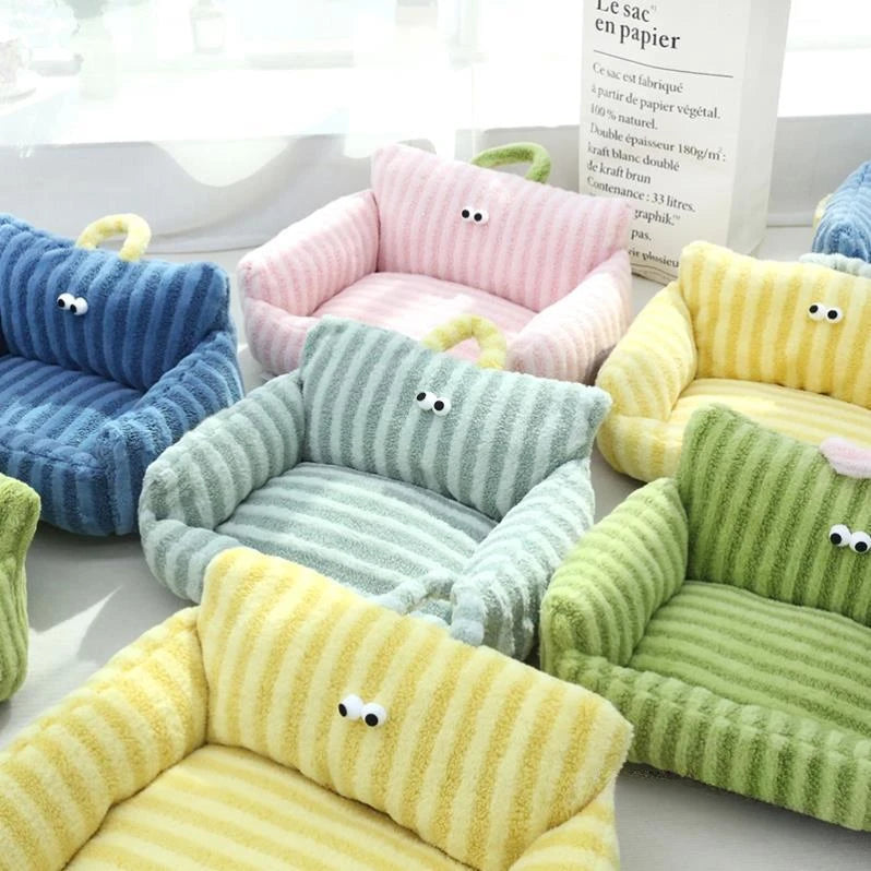 Colorful striped velvet pet beds with cartoon eyes – cozy nest for cats and dogs.