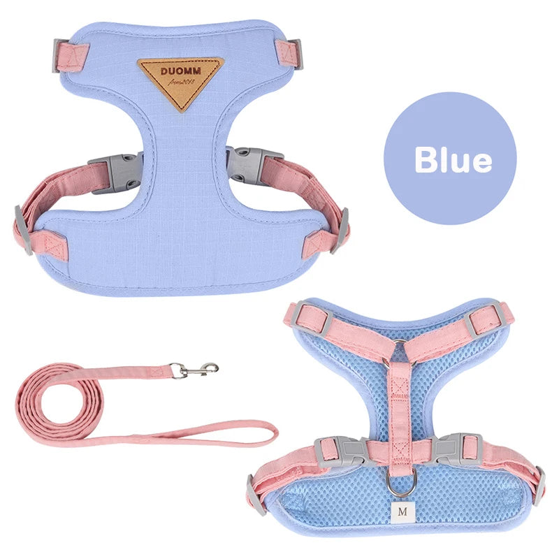 Blue pet harness with matching pink leash, soft and adjustable for pets.