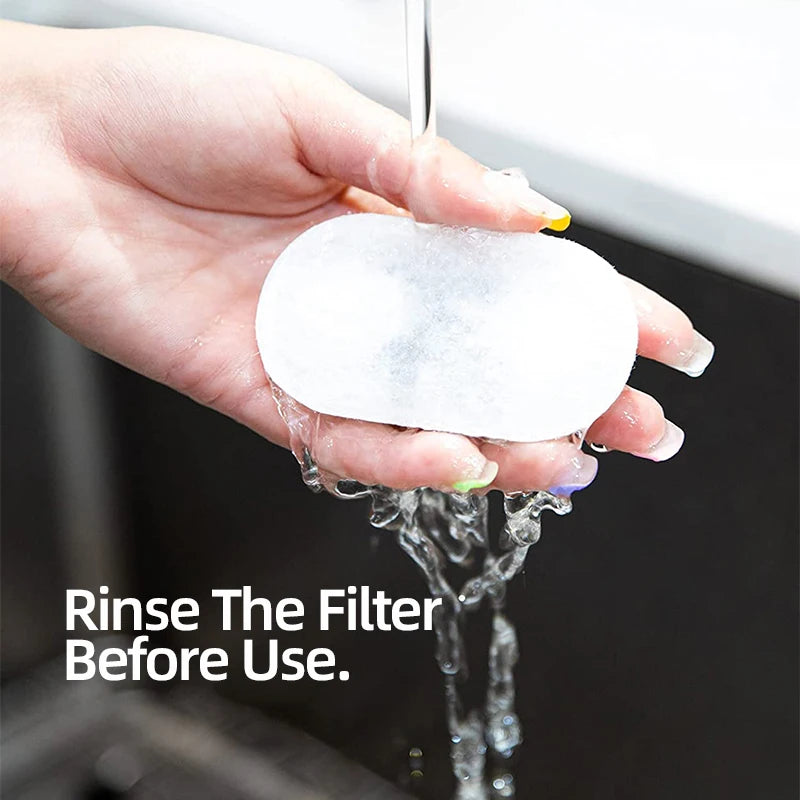 Hand holding a white filter under running water with text 'Rinse The Filter Before Use.'